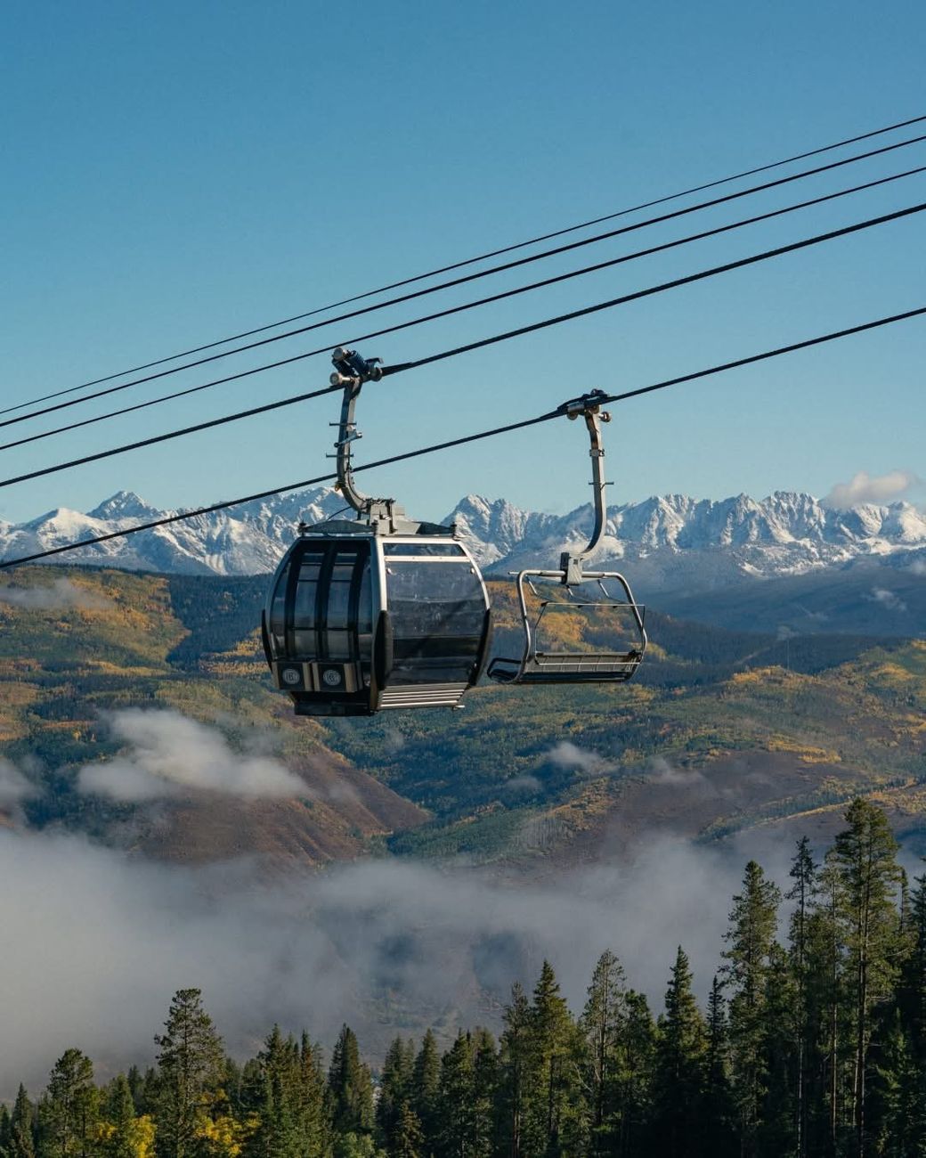 Gondola cabin and chairlift over the Rocky Mountains