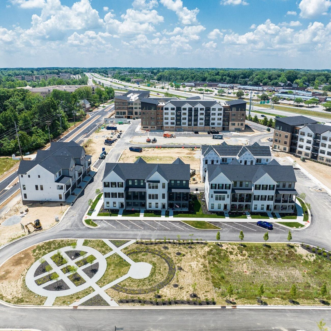 Aerial view of a new townhome and apartment development under construction
