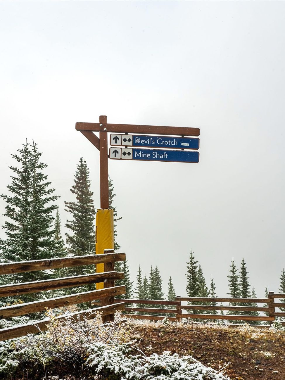 Ski trail sign reading Devil's Crotch and Mine Shaft